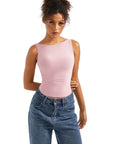 Pink sleeveless bodysuit with wide neckline, paired with high-waist jeans for casual women's fashion