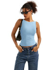 Light blue sleeveless crop top with high-waisted jeans, stylish women's fashion outfit