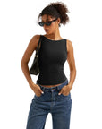 Black sleeveless crop top with high-waisted jeans, stylish women's fashion outfit