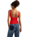 Red backless tank top with wide straps, paired with blue jeans, women's fashion